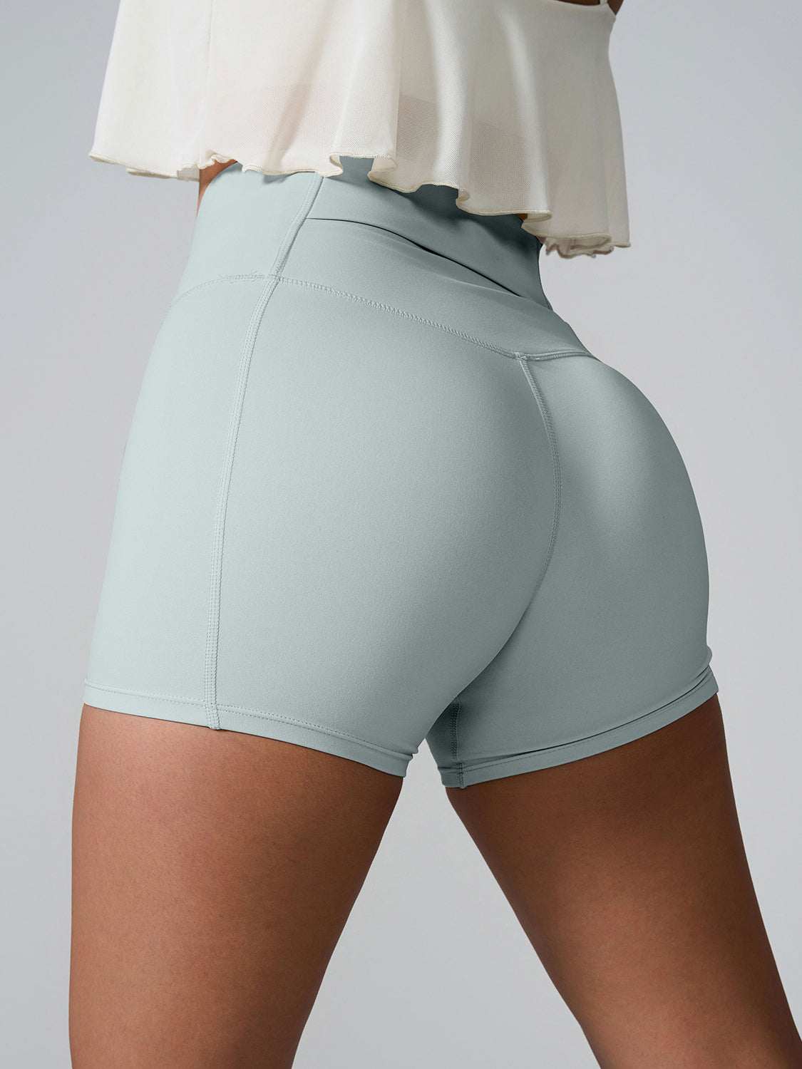 High Waist Active Shorts with pockets, highly stretchy nylon and spandex, back view.