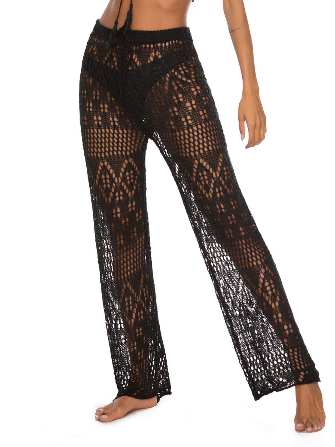 Cutout straight swim pants with moderate stretch and intricate design, made from 100% polyester.