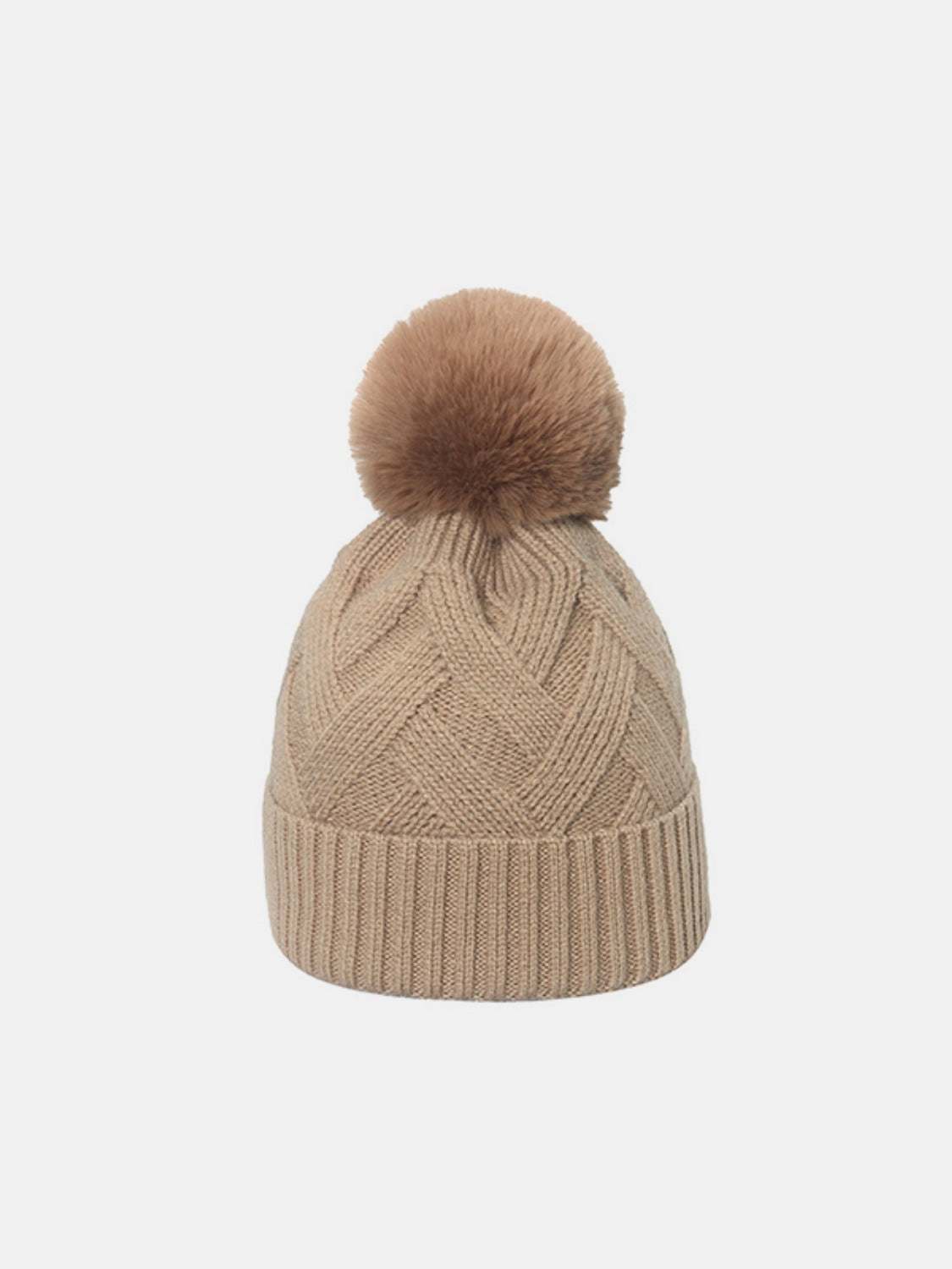 Beige roll rim hat with pompom made of acrylic and polyester.