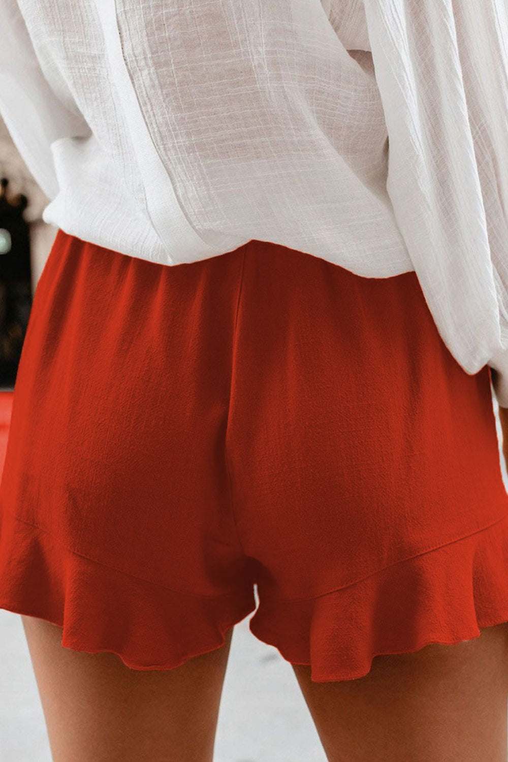 Full size ruffled elastic waist shorts in red with a comfortable fit.