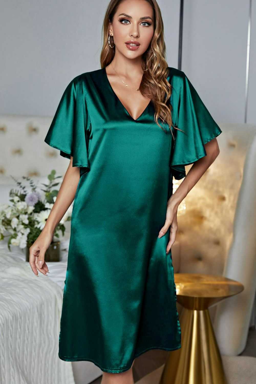 Satin flutter sleeve V-neck night dress with side slit in solid green color.