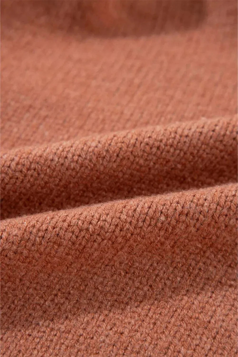 Close-up of a slightly stretchy fabric of an Open Front Dropped Shoulder Cardigan in a warm brown tone.