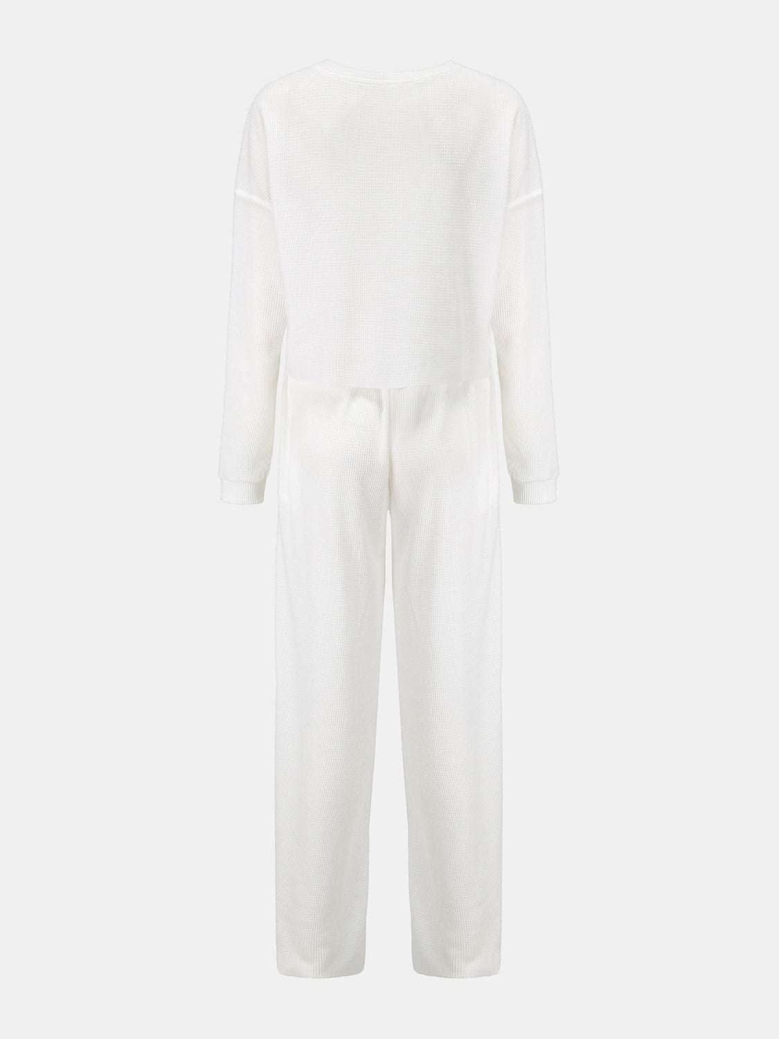 Waffle-knit round neck top and pants set in white, two-piece, slightly stretchy fabric.