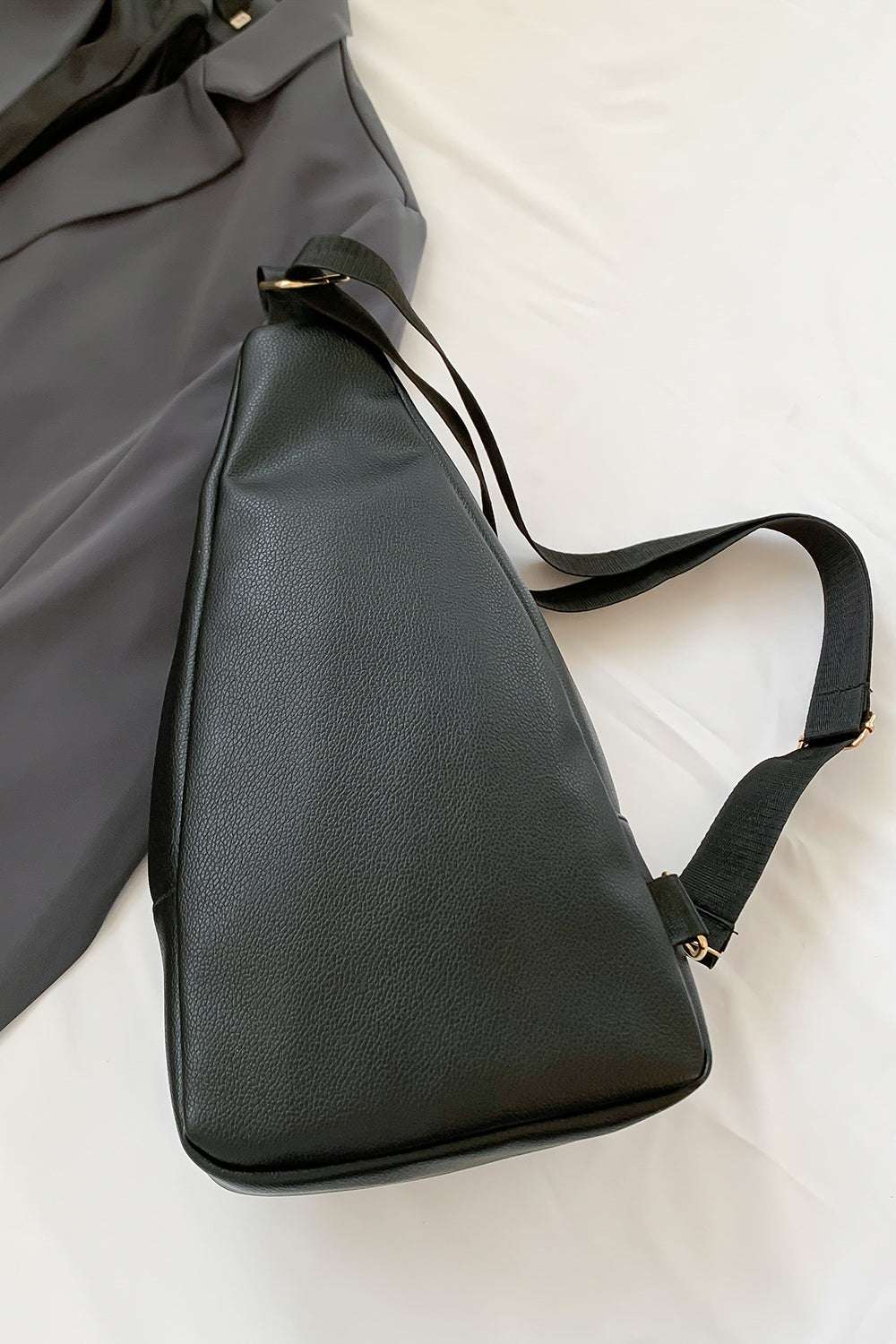 Medium black PU leather sling bag, imported, with dimensions 7.5x2.8x14.2 inches.