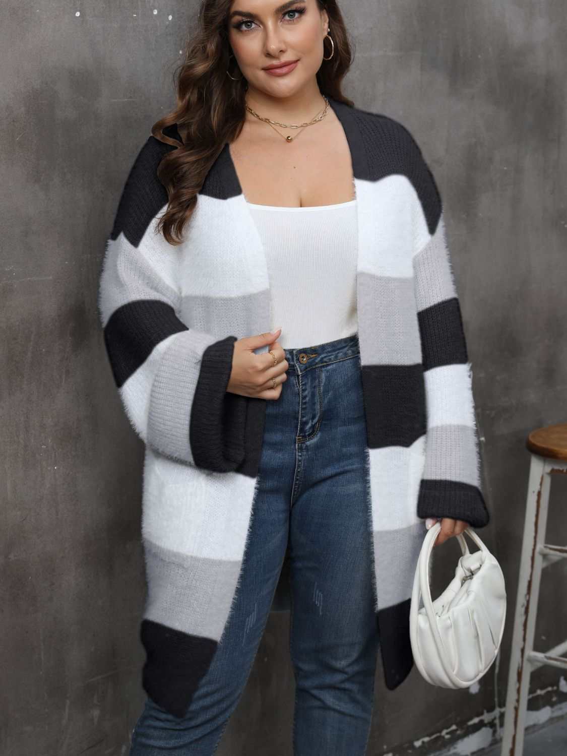 Plus size open front long sleeve cardigan in black, white, and gray blocks.