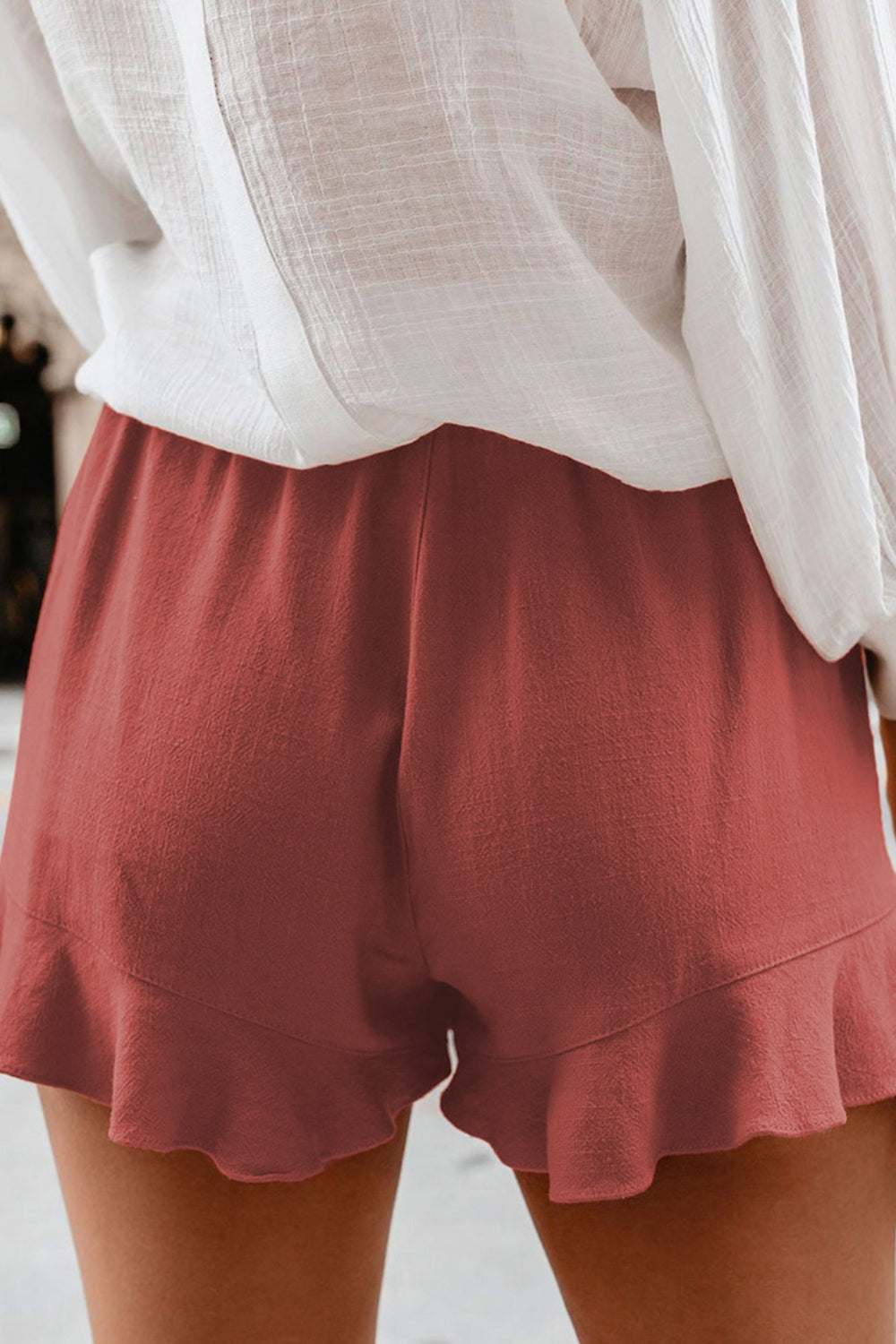 Full size ruffled elastic waist shorts in red, polyester and spandex blend.