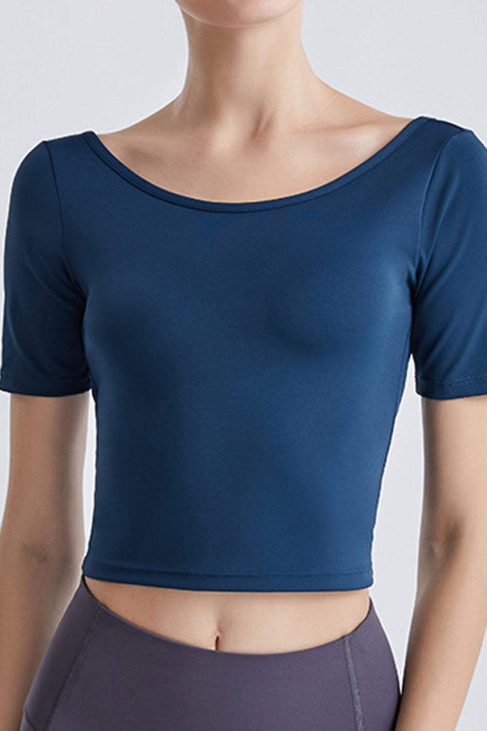 Cutout backless round neck active t-shirt in blue with short sleeves.