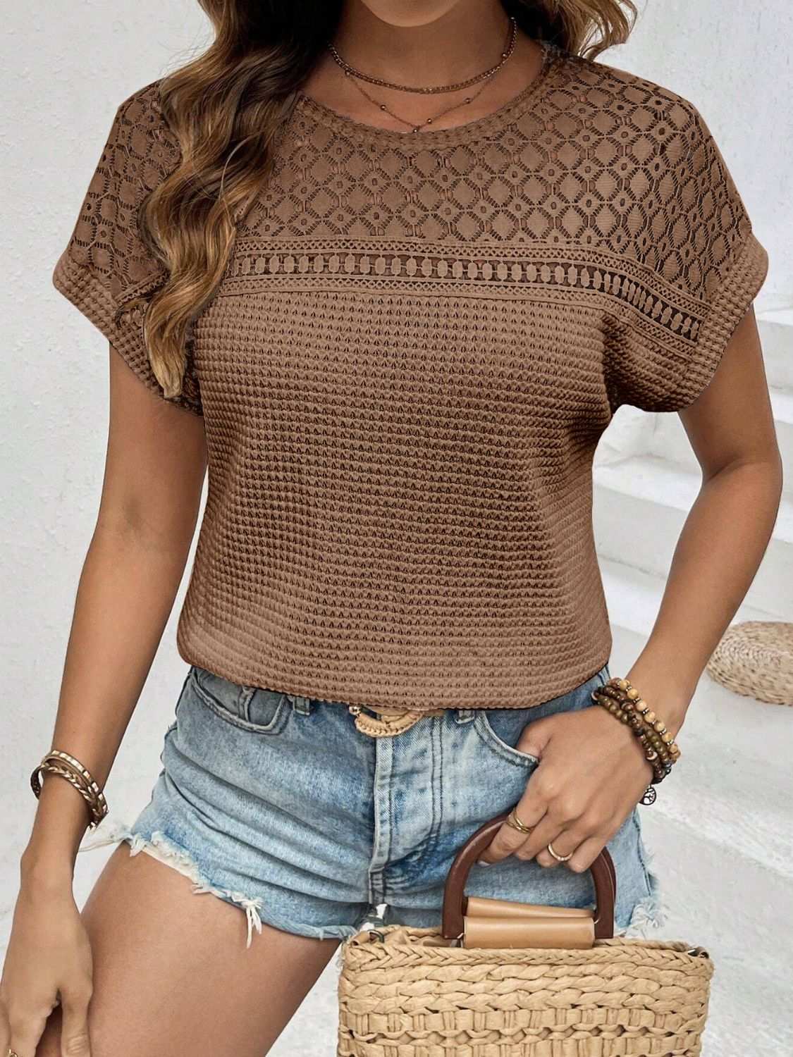 Waffle-knit round neck short sleeve top with lace detail in brown.