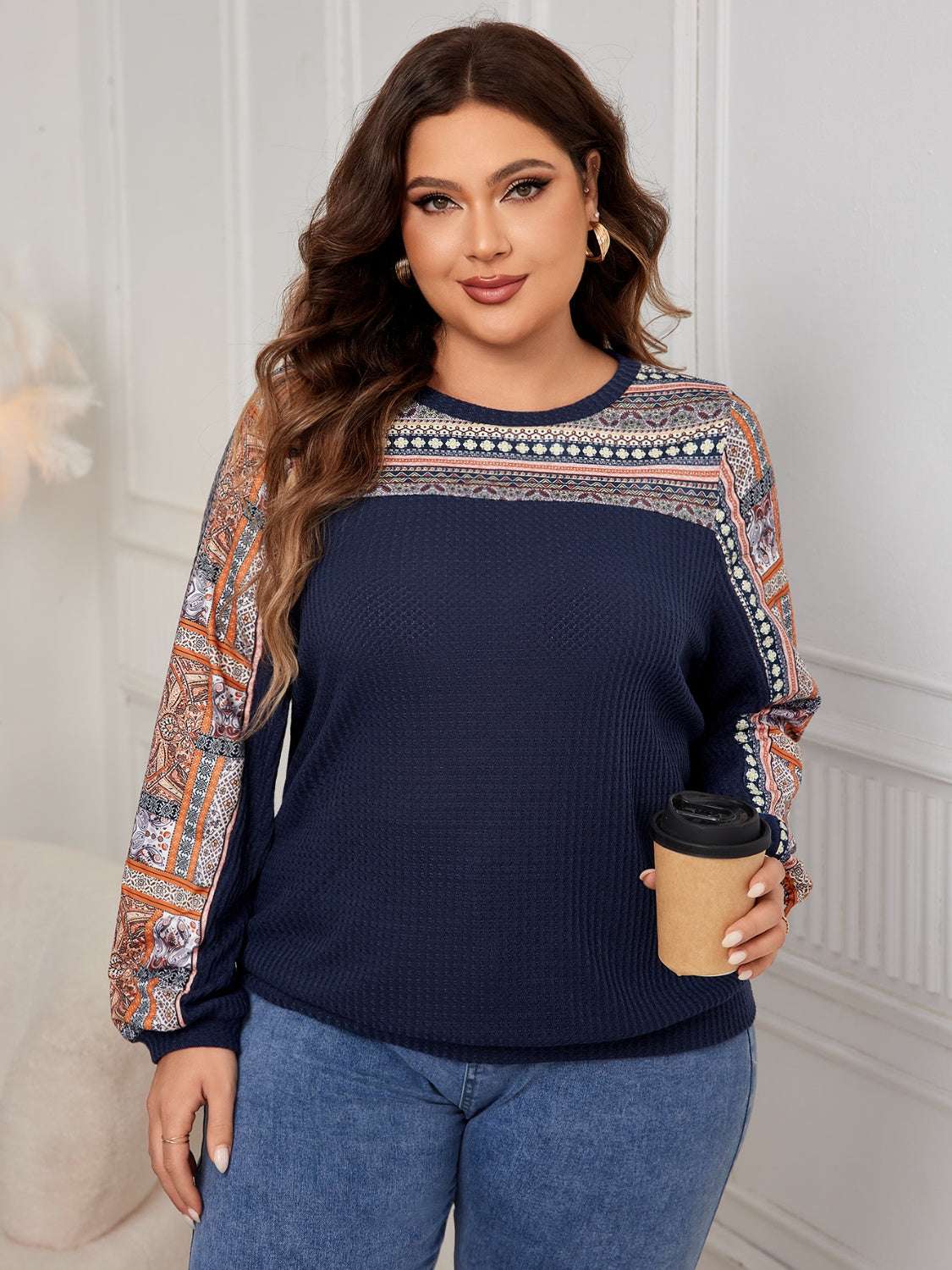 Plus-size navy printed long sleeve sweatshirt with intricate patterns.