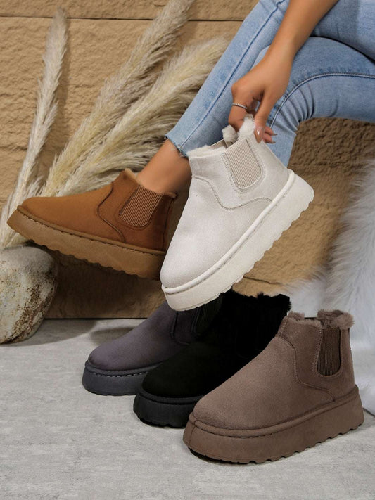 Suede round toe platform boots in multiple colors with faux fur lining and flat heels.