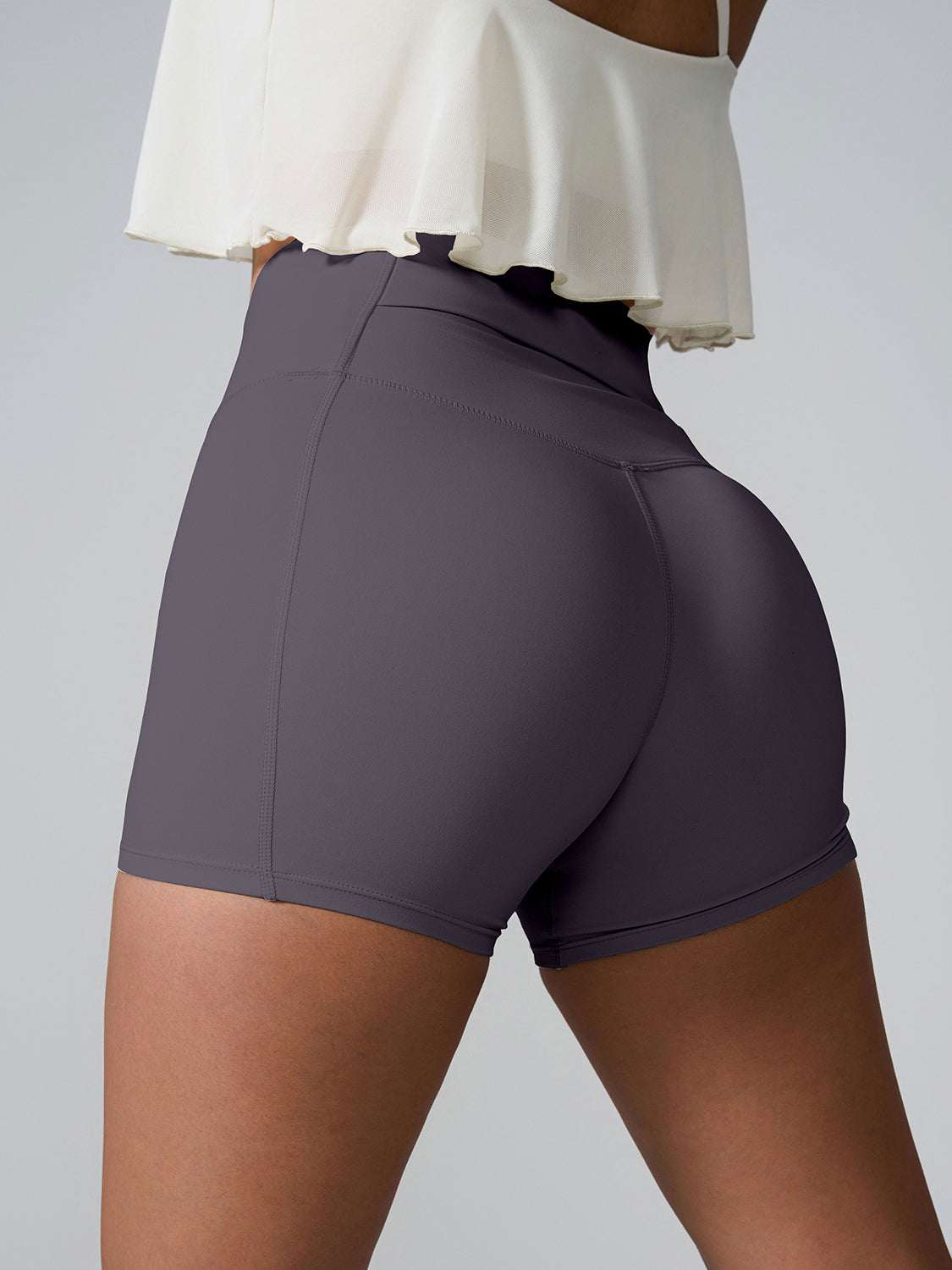 High Waist Active Shorts with pockets in gray, shown on model.