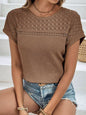 Waffle-knit round neck short sleeve top with lace detailing, semi-sheer fabric.