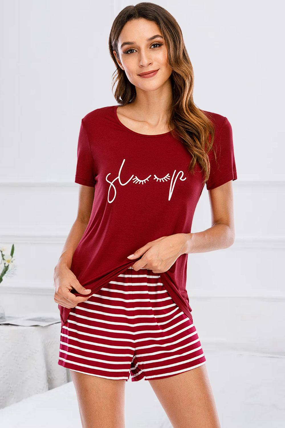 Graphic round neck top and striped shorts lounge set in red, featuring stretchy rayon and spandex fabric.