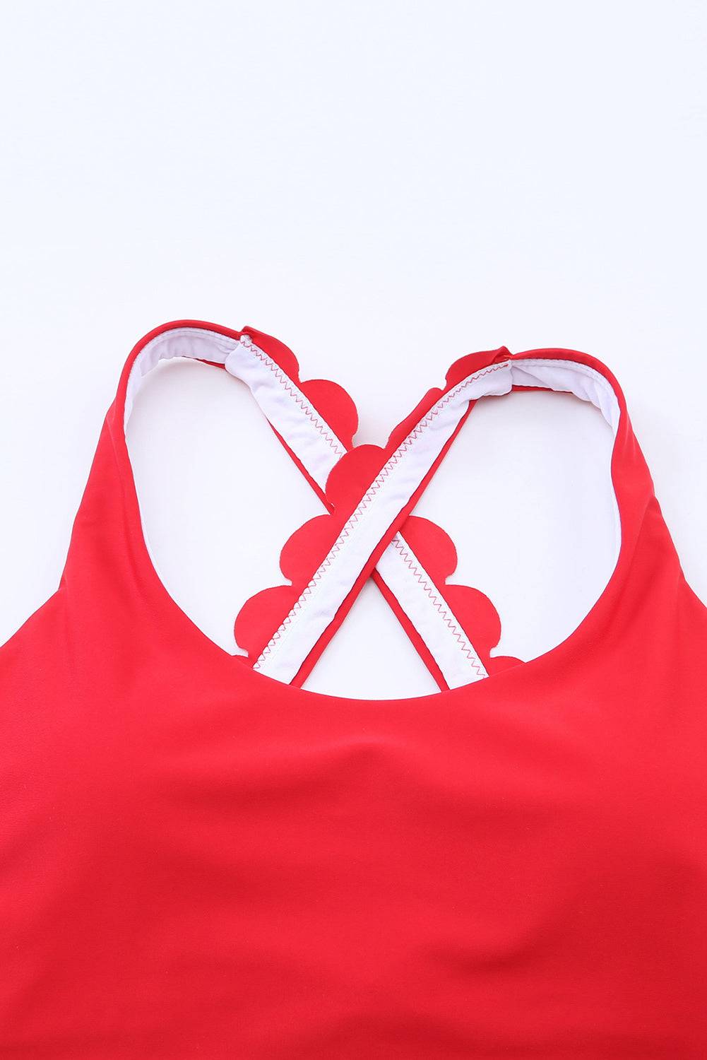 Red crisscross scoop neck swim top with removable padding.