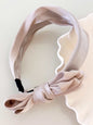 Bow polyester wide headband, 1.6-inch width, light pink color.