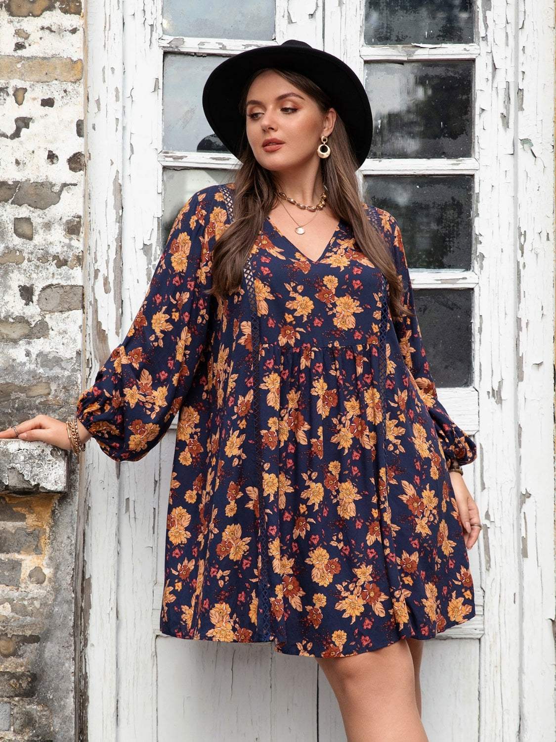 Plus size floral V-neck balloon sleeve dress in blue and orange viscose.