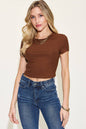 Basic Bae Full Size Ribbed Round Neck Short Sleeve T-Shirt in brown, modeled by a woman in jeans.