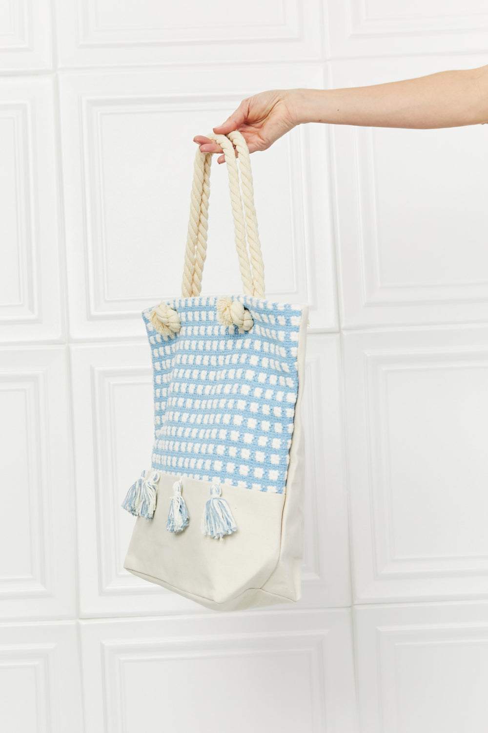 Justin Taylor Picnic Date Tassel Tote Bag with plaid pattern and sturdy rope handles.