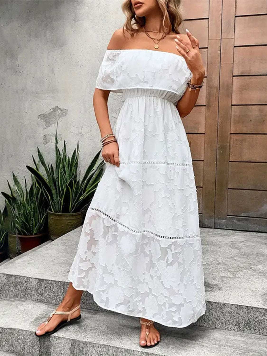 Off-shoulder short sleeve semi-sheer white maxi dress made of 100% polyester.