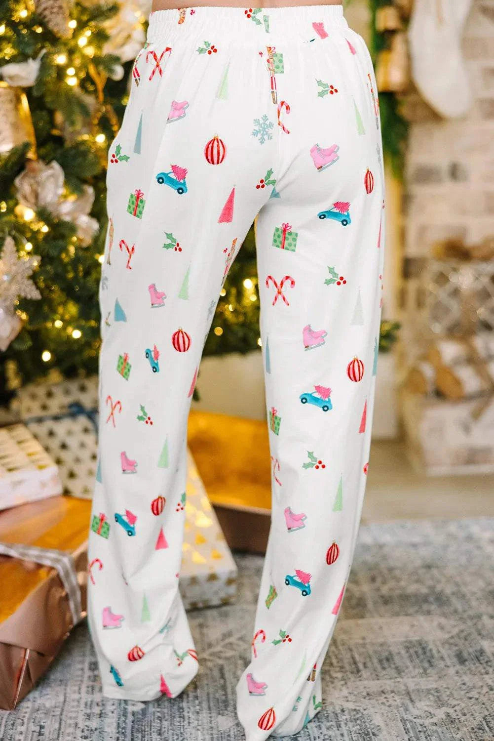 Printed Collared Neck Long Sleeve Top and Pants Lounge Set with holiday-themed pattern, pocketed, slightly stretchy fabric.