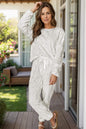 Women's round neck long sleeve top and pants lounge set with drawstring.