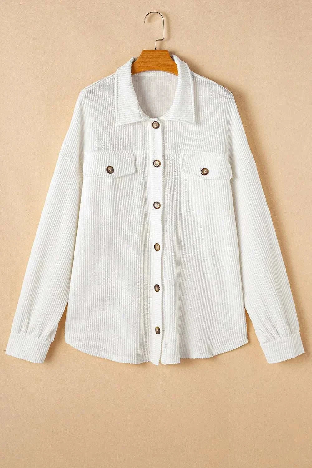 Plus size button up long sleeve jacket with front pockets and button detailing.