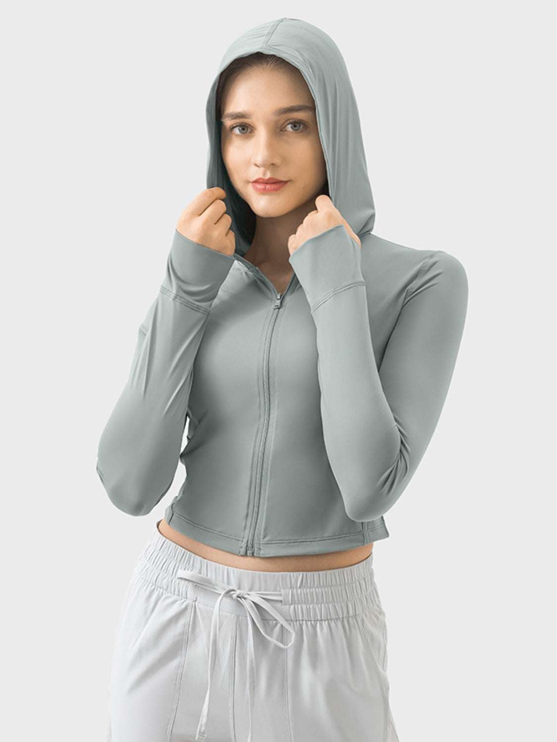 Millennia hooded zip-up long sleeve activewear in light gray.