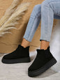 Suede round toe platform boots with faux fur and rubber sole, flat heel style.