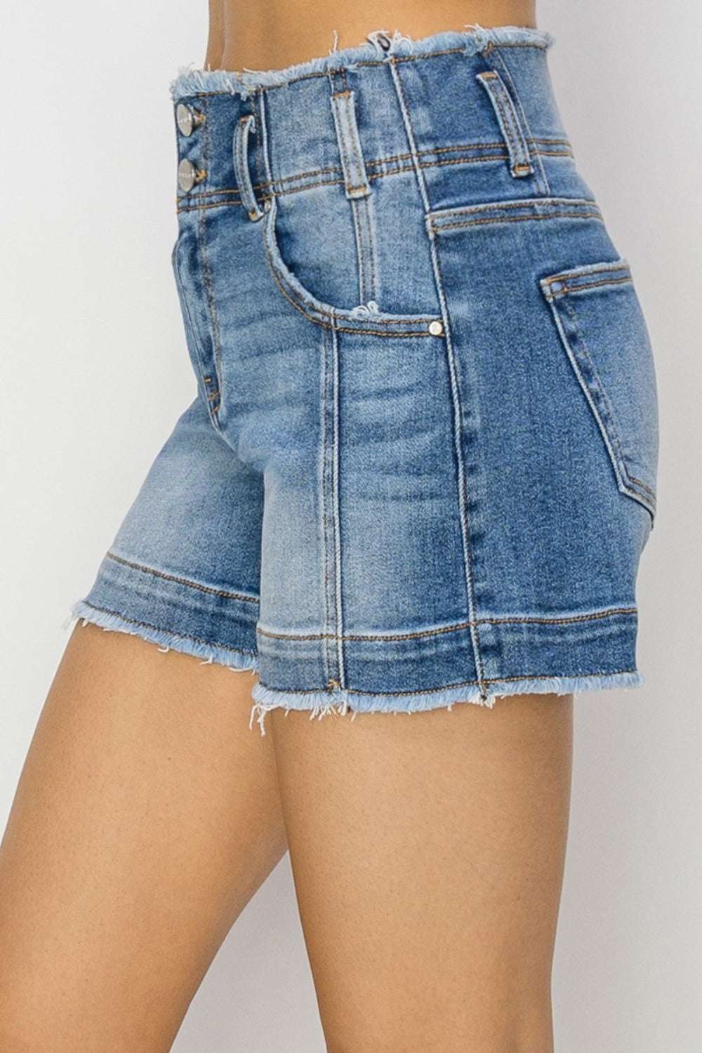 RISEN high rise seam detailed raw edge denim shorts with pockets and raw hem.