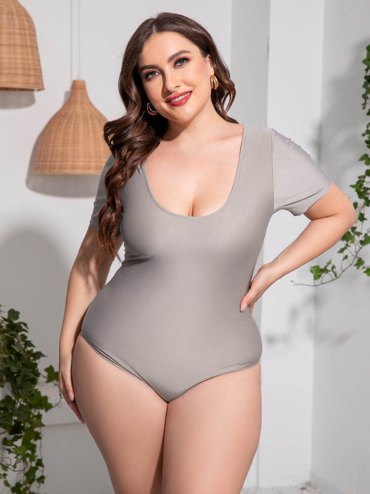 Plus size scoop neck short sleeve one-piece swimsuit, solid color, stretchy beachwear.