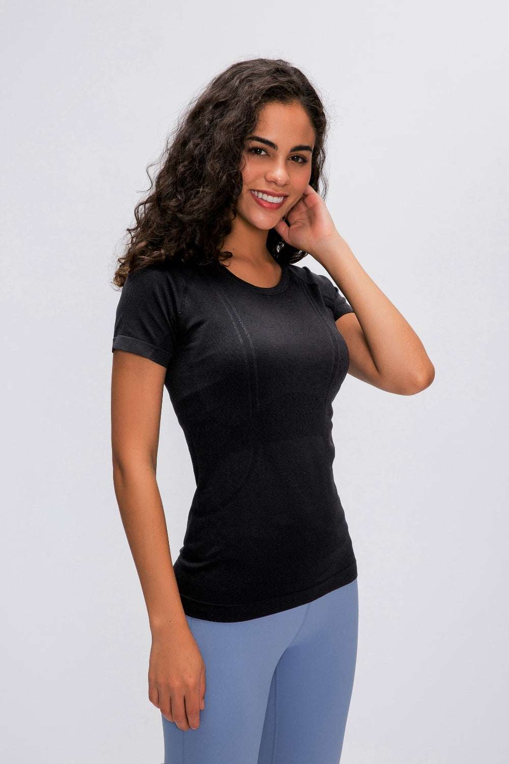 Millennia Round Neck Short Sleeve Active T-Shirt in black worn by a model.