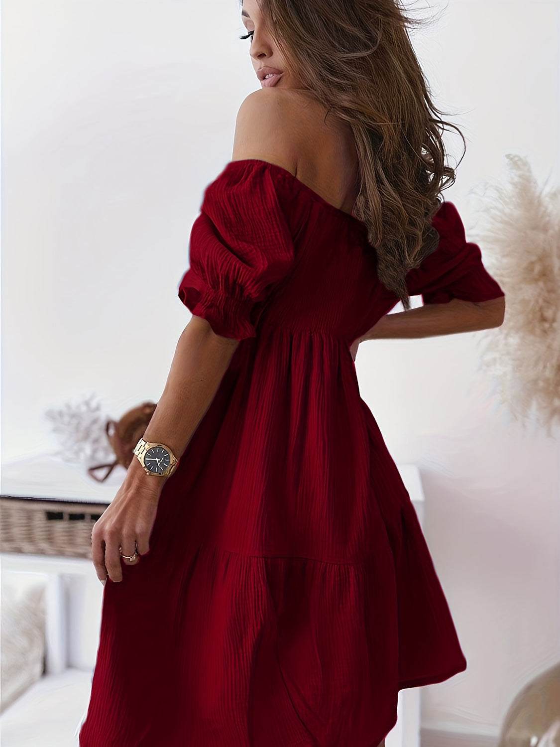 Full-size red ruffled off-shoulder short sleeve dress with ruched detailing.