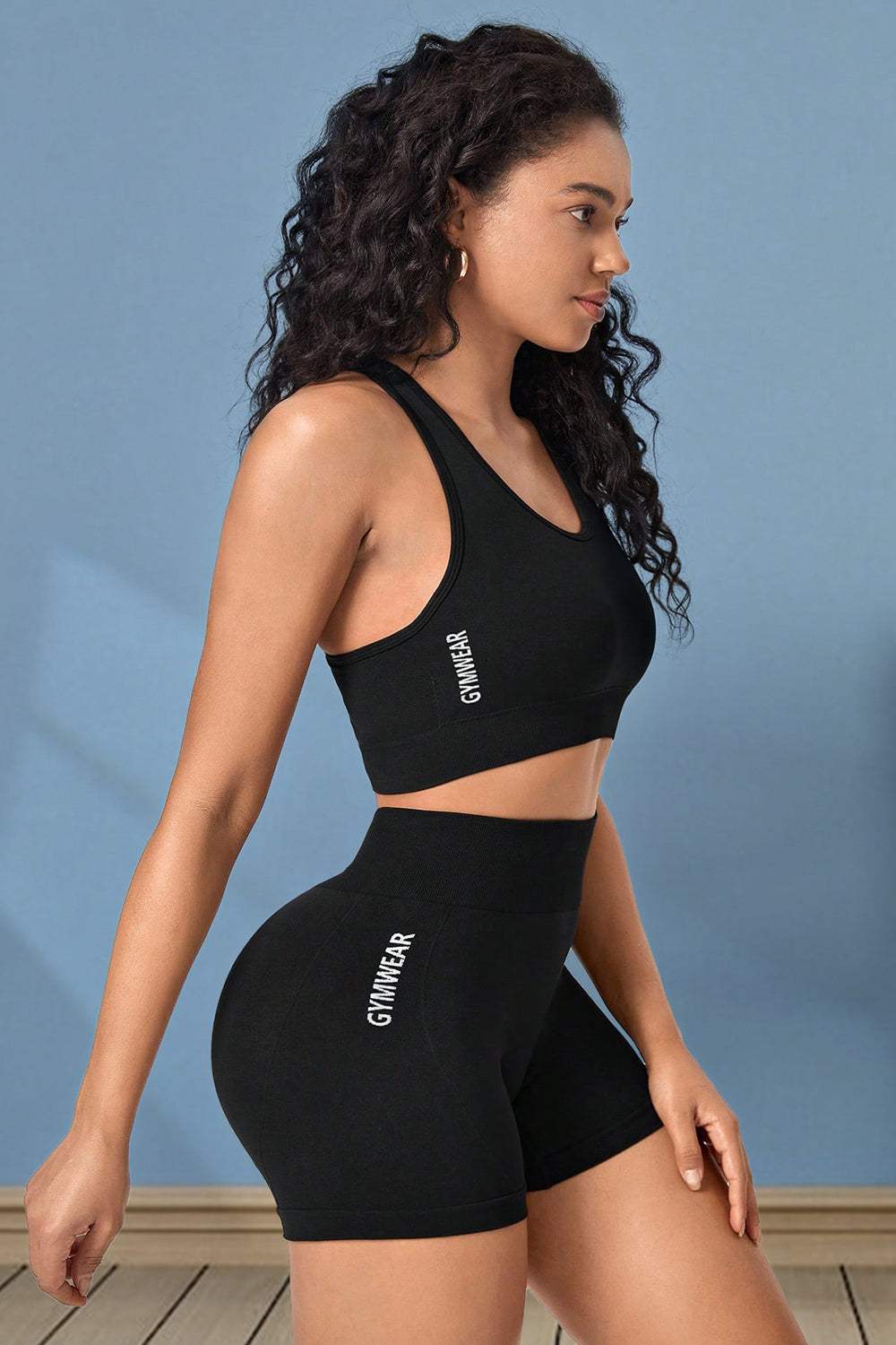 Cropped sports tank and shorts set in black, highly stretchy material.