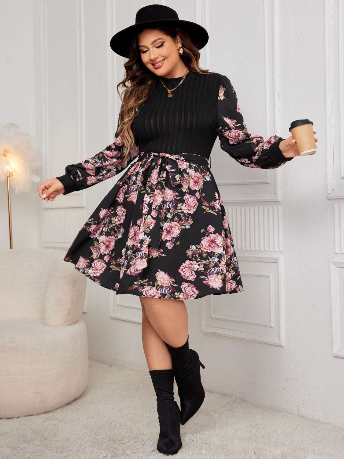 Plus size tied printed long sleeve dress with floral design.