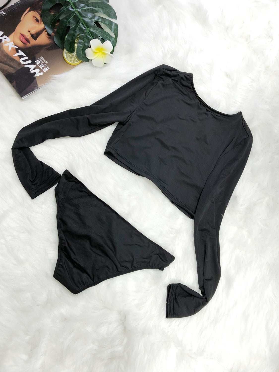 Round neck long sleeve top and brief swim set in black, two-piece, highly stretchy material.