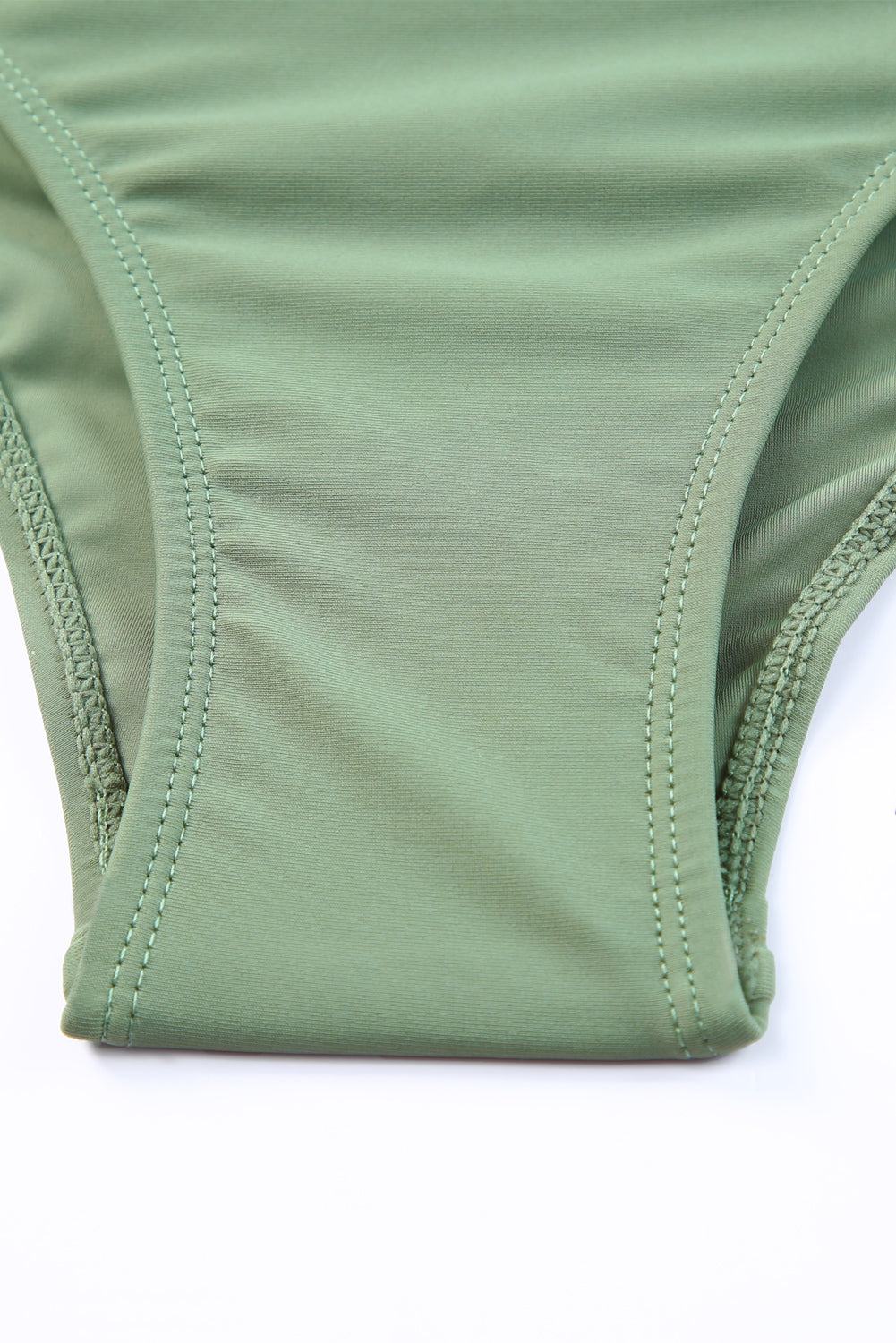 Tie back sleeveless swim dress with mid-waist bottoms in solid green.