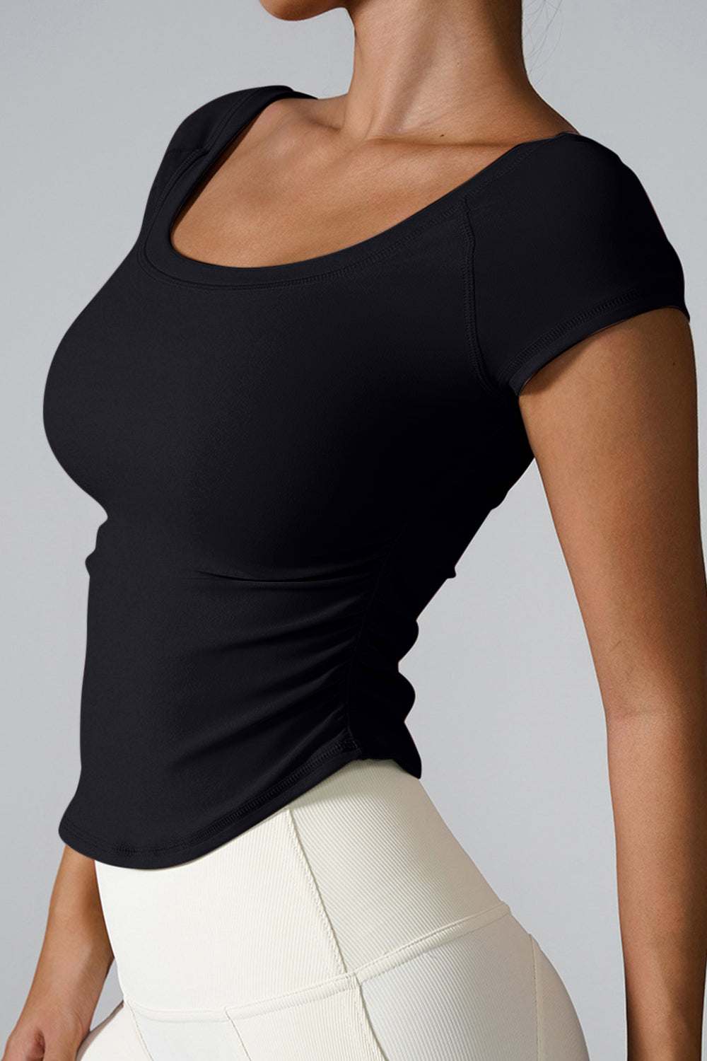 Round neck short sleeve active T-shirt, highly stretchy black fabric.