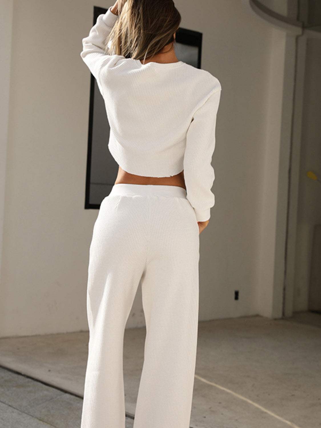 Waffle-knit round neck top and pants set in white, two-piece outfit, slightly stretchy fabric.