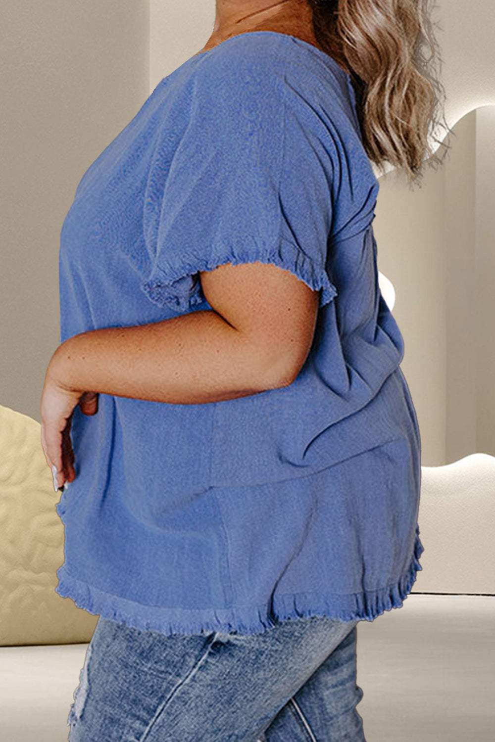 Plus size blue round neck half sleeve top with slight stretch.