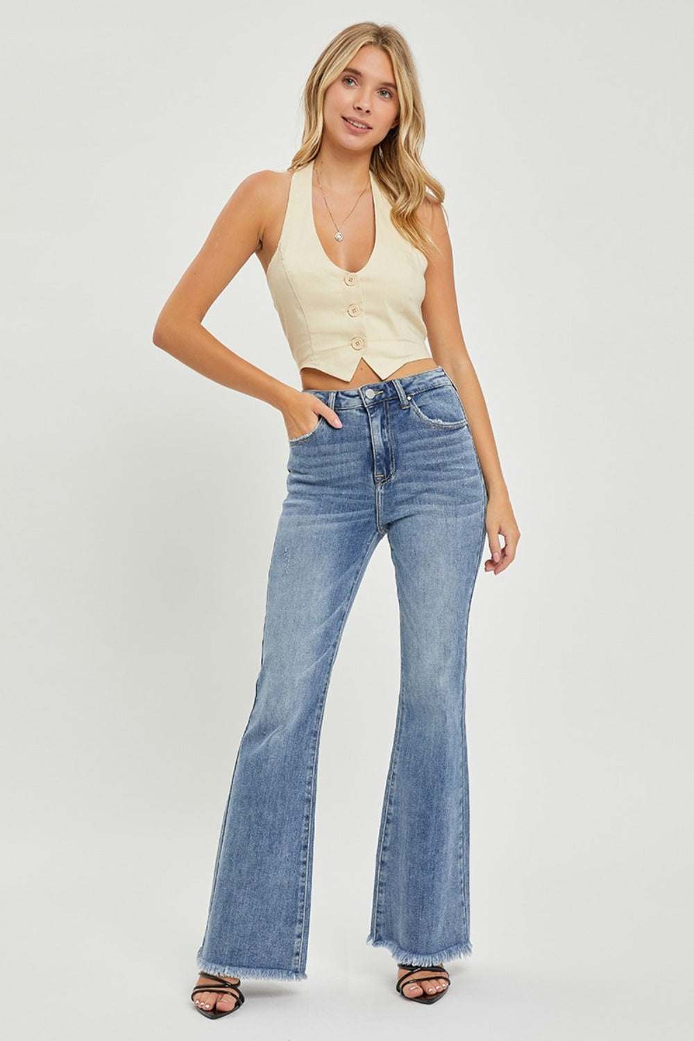 RISEN Full Size High Waist Raw Hem Flare Jeans with chic retro-inspired style and raw hem detailing.