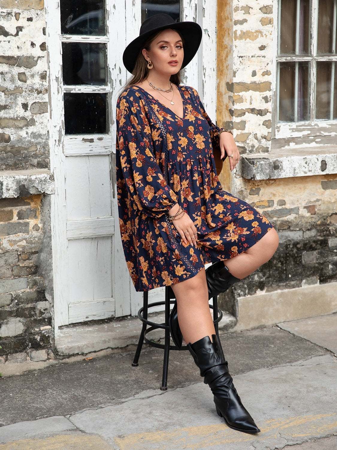 Plus Size Floral V-Neck Balloon Sleeve Dress in outdoor setting.