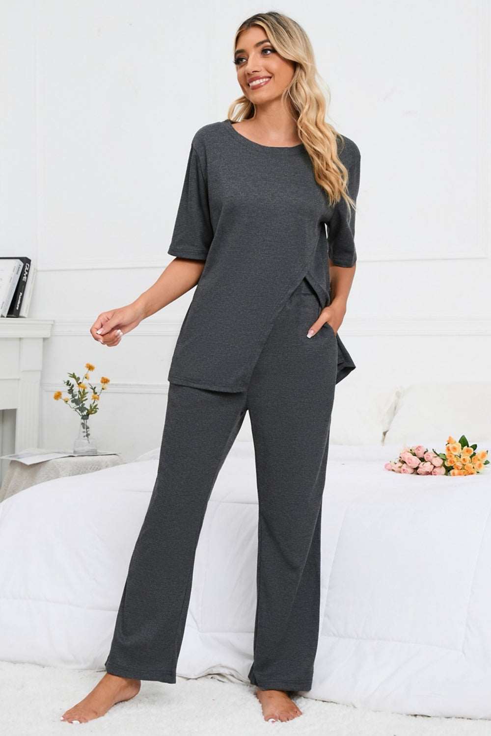 Slit Round Neck Top and Pants Lounge Set in dark gray, two-piece, slightly stretchy polyester fabric.