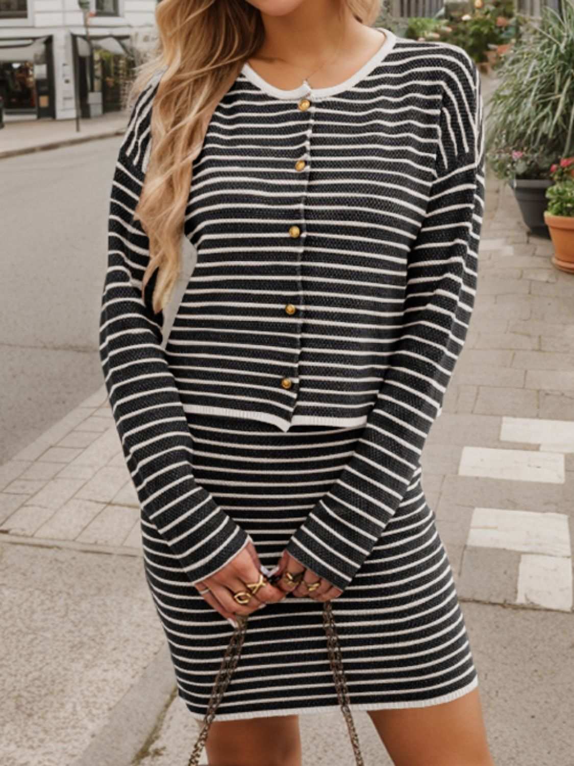 Striped long sleeve top and skirt set with buttoned detail, no stretch, black and white design.