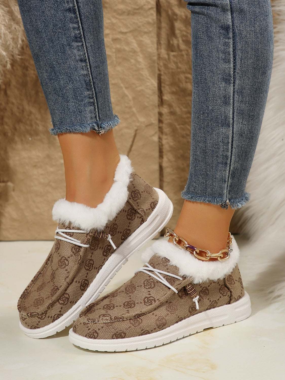 Women's printed round toe flat slip-ons with faux fur and cotton material.