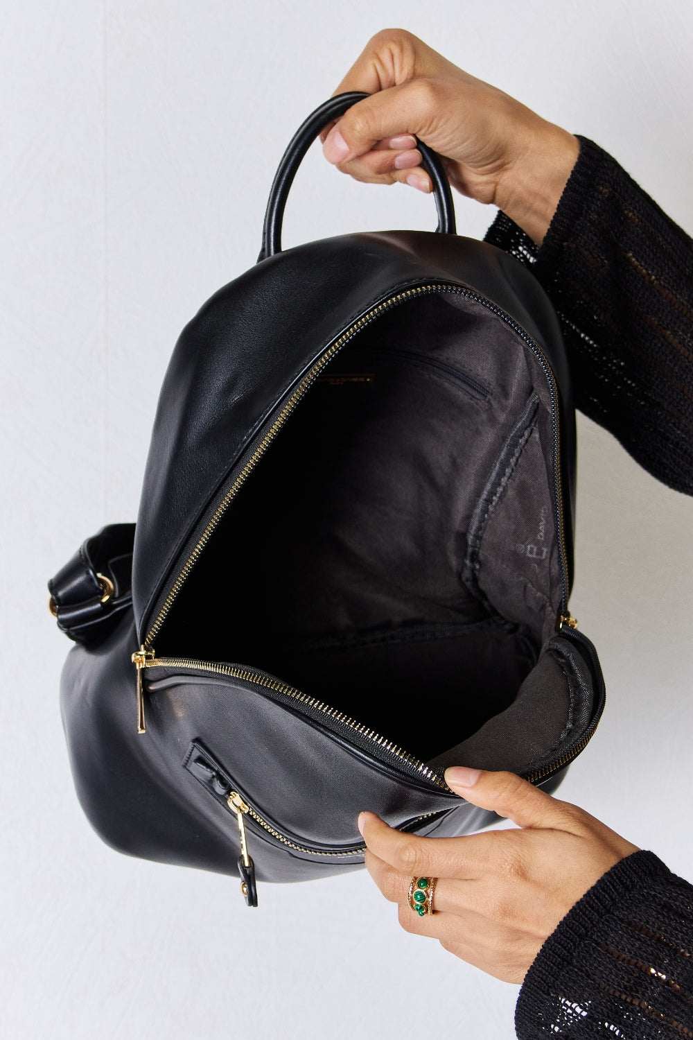 David Jones PU Leather Backpack, spacious interior, sleek black design.