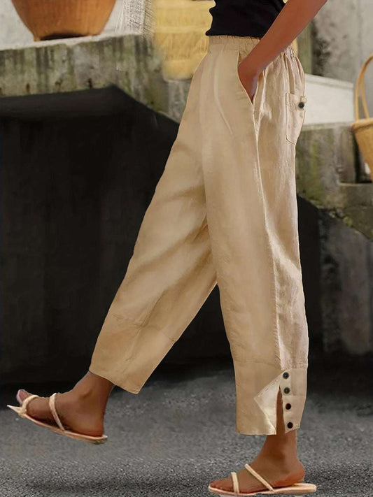 Plus size wide leg pants with pockets and button detail.