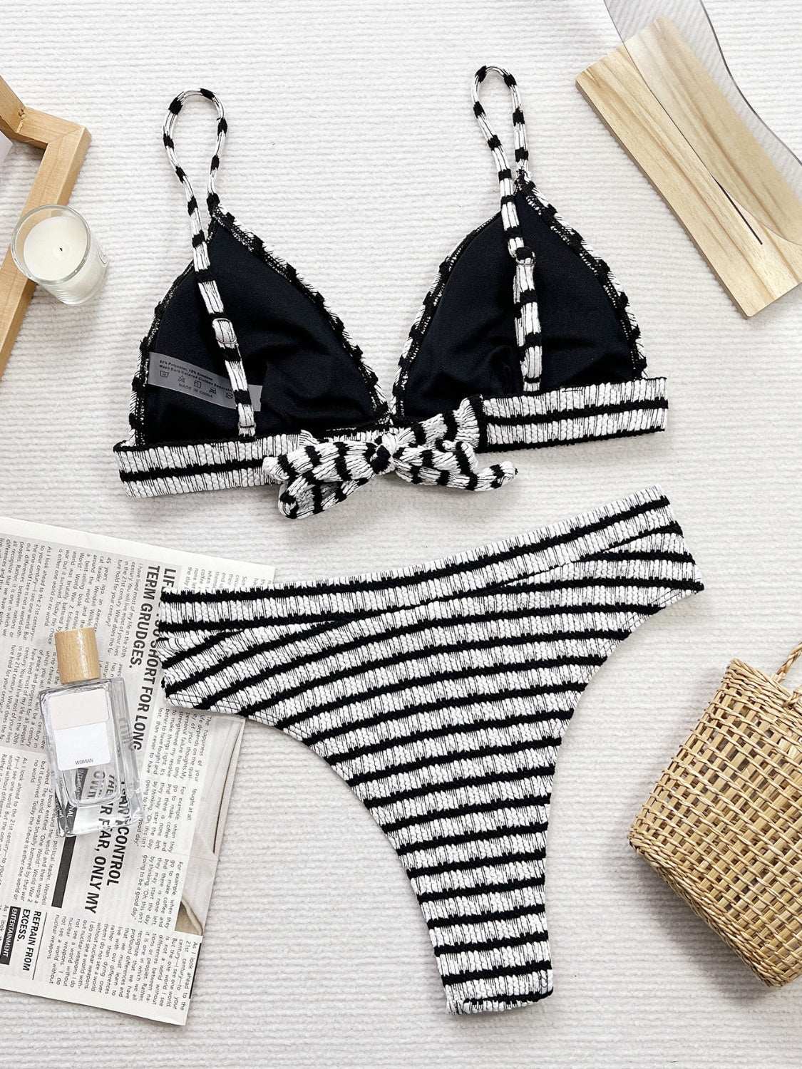 Striped V-Neck Two-Piece Swim Set with non-removable padding, black and white design, and slightly stretchy material.