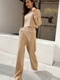 Waffle-knit round neck top and pants set in beige, featuring a slightly stretchy fabric.