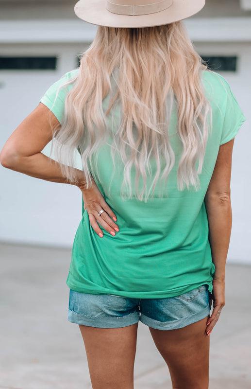 Women's green crew neck printed short sleeve t-shirt, back view.