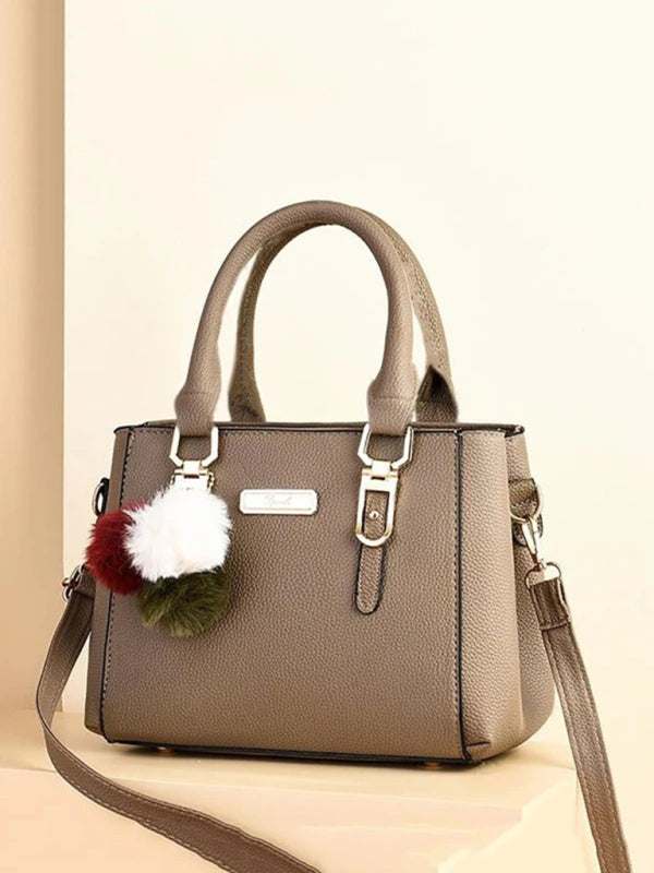 women's handbag fashion all-match shoulder bag in light brown PU leather with pom-pom accents, ideal for spring-summer outings.